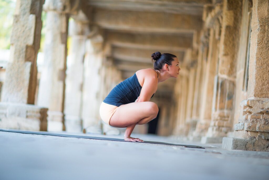 Ashtanga Yoga Level 2 authorized teacher Krista Shirley in Kukkutasana pose in Mysore, India, 2015.