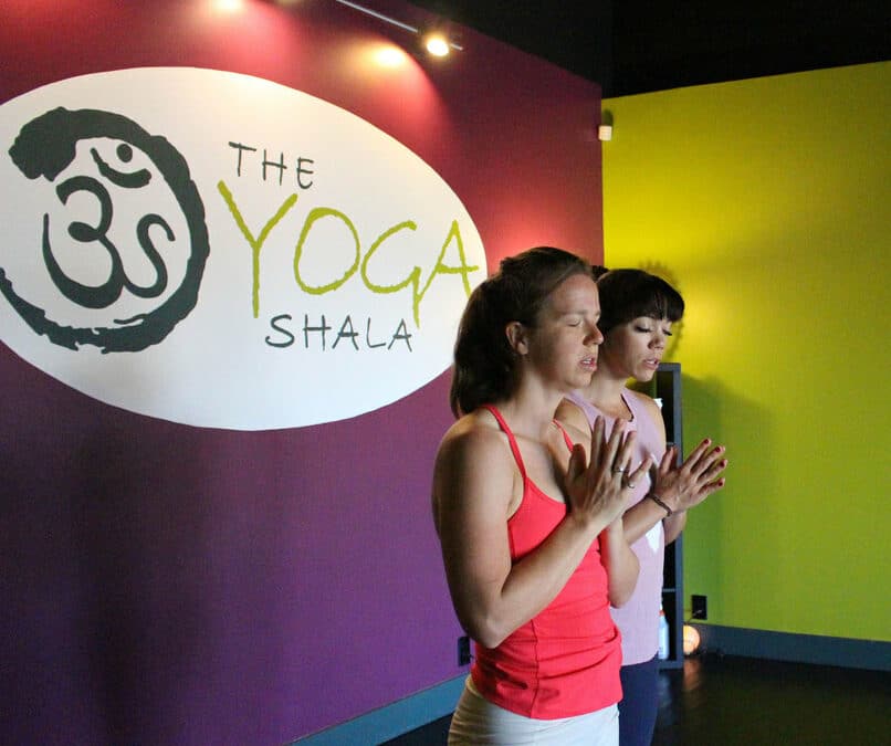 Owner Krista Shirley and a student chant the Ashtanga Yoga opening mantra at the Yoga Shala in Maitland, Florida. The studio, located at 140 Circle Drive #4, offers Mysore style Ashtanga Yoga classes accessible to practitioners of all levels, led by Krista, a Level Two authorized Ashtanga Yoga teacher.