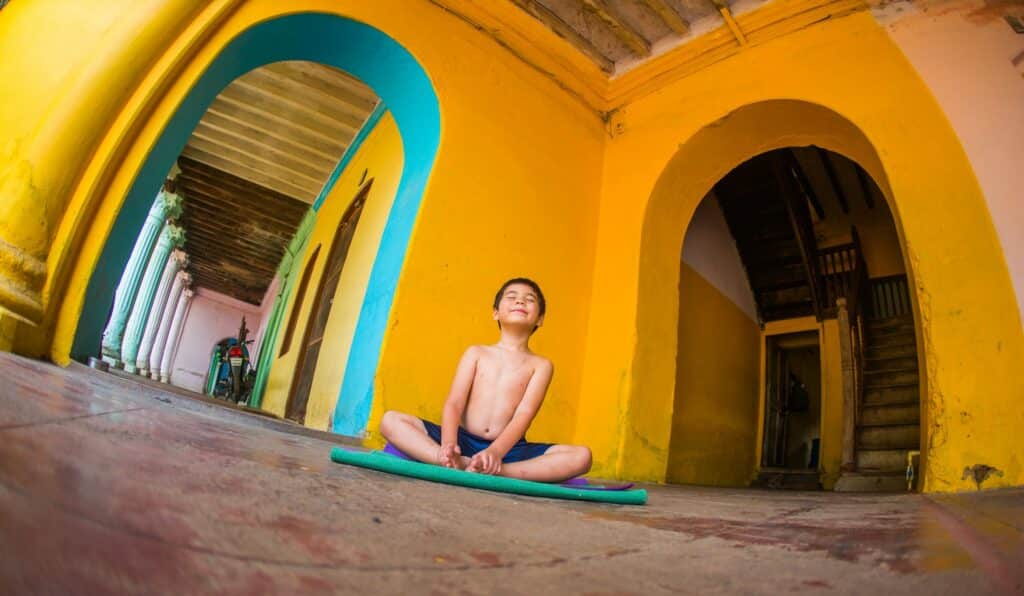 Kaiden Park, son of Ashtanga Yoga Level 2 authorized teacher Krista Shirley, in Baddha Konasana pose in Mysore, India, 2015.